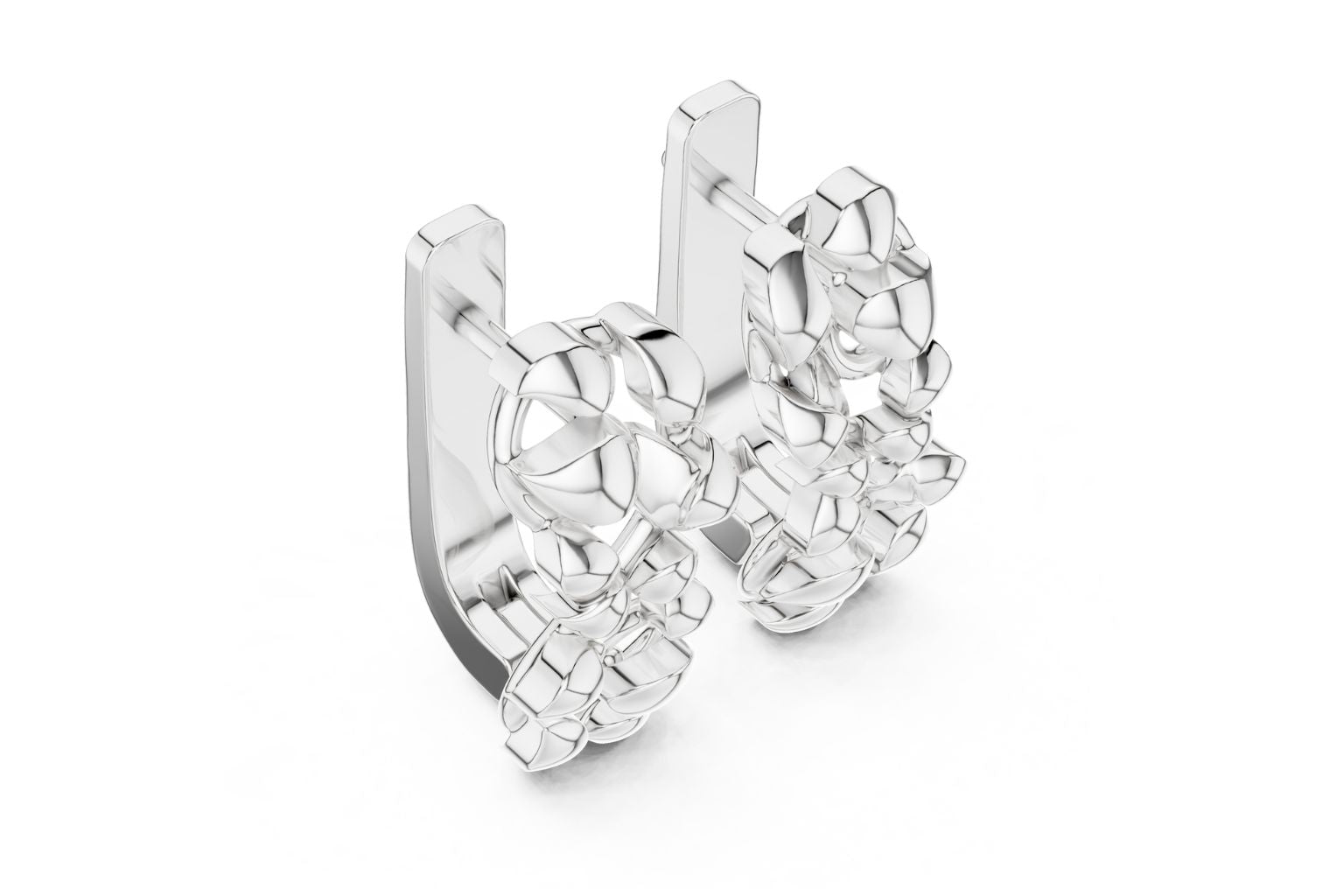 Silver hoop earrings with clear gemstones on a white background