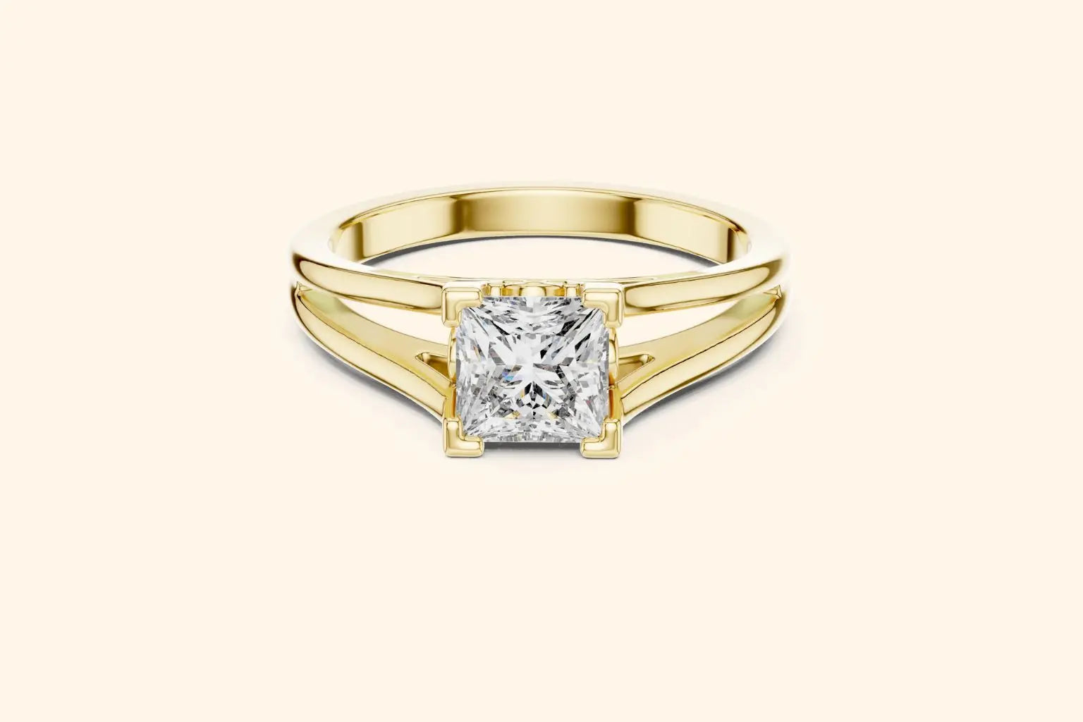 Front view of a yellow gold solitaire engagement ring with a radiant-cut diamond set horizontally in a bezel or partial bezel setting, featuring a minimalist split-shank band.