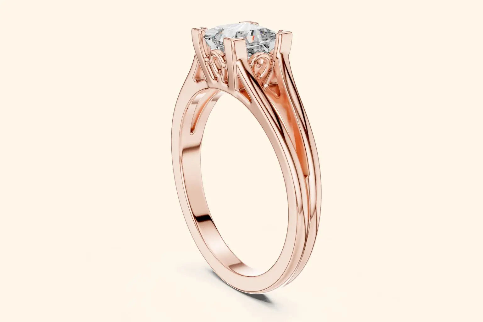 Close-up side view of a rose gold solitaire engagement ring featuring a square brilliant-cut (Princess or Cushion) diamond set in a four-prong setting with decorative filigree details under the basket and a split-shank band.