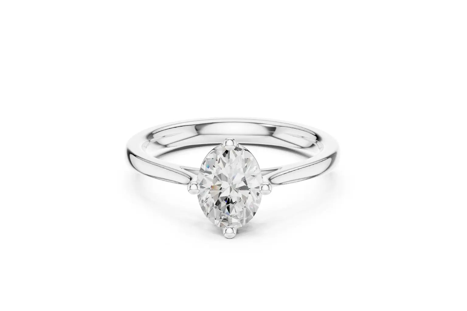 A classic solitaire engagement ring featuring an oval-cut diamond set in a sleek, four-prong compass style on a polished white gold or platinum band.