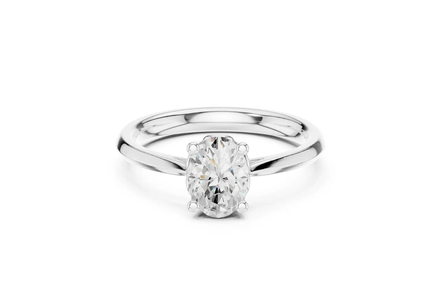 A classic solitaire engagement ring featuring an oval-cut diamond held by six prongs on a polished white gold or platinum band.