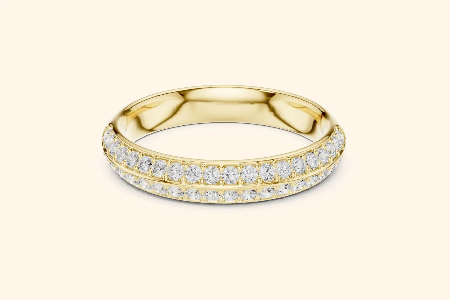 A brilliant pure gold eternity band ring featuring two continuous rows of round brilliant diamonds set in a pave style. The gold band is highly polished, providing a rich contrast to the dazzling, closely-set diamonds that encircle the ring.