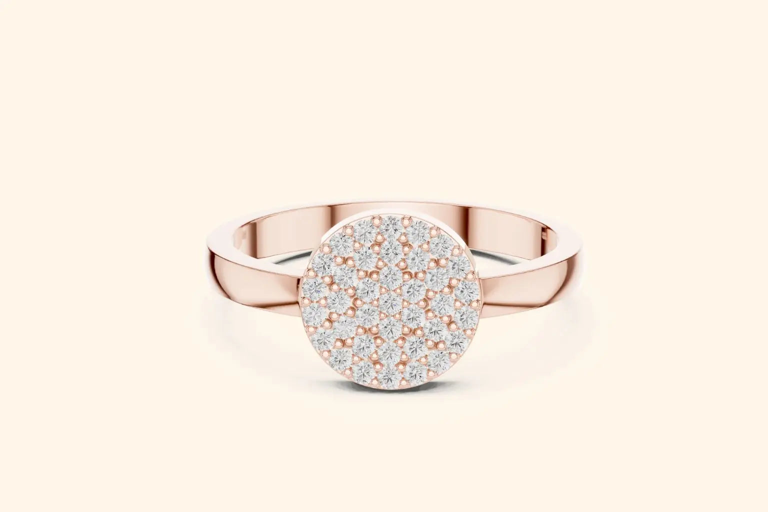 A straight-on view of a chunky, modern rose gold ring with a round, flat top. The entire circular surface of the head is covered in brilliant pave-set diamonds.