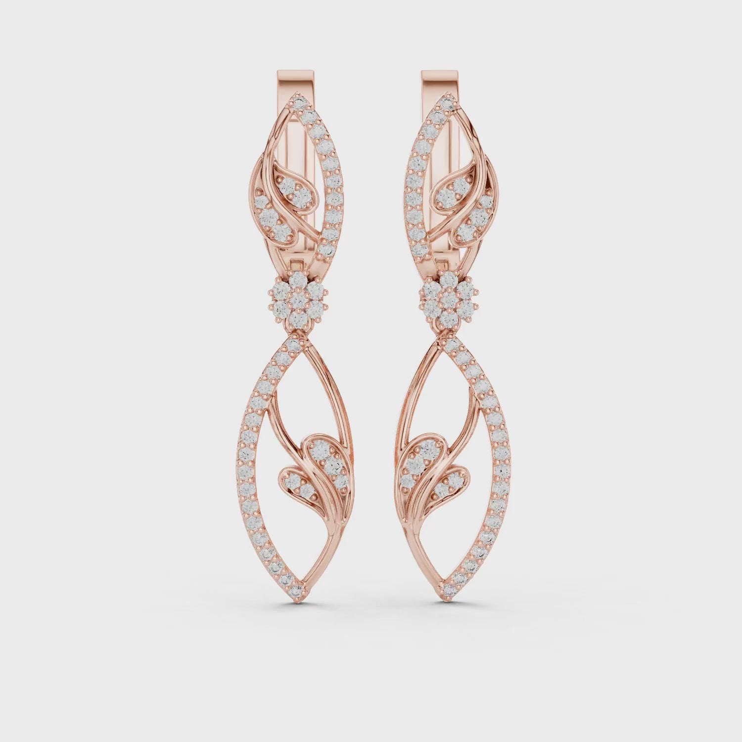 Pair of rose gold lever back earrings, each with a single round diamond.