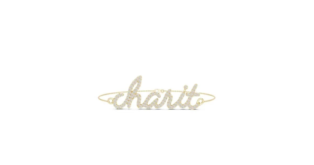 Personalized script name bracelet (Charit) featuring pavé diamonds, set in yellow gold with a delicate chain.