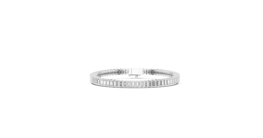 A single-row baguette cut diamond/gemstone tennis bracelet in a brilliant silver or white metal setting, with a secure box clasp visible.