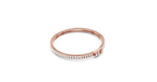 Double-row rose gold baguette and round diamond tennis bracelet, shown in a closed circle.