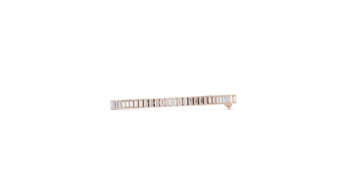 Close-up side view of a single-strand tapered baguette bracelet in rose gold, showing the setting.
