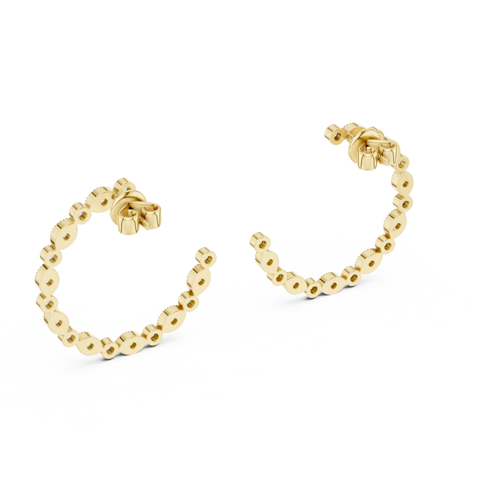 Gold hoop earrings with a beaded design on a white background