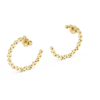 Gold hoop earrings with a beaded design on a white background