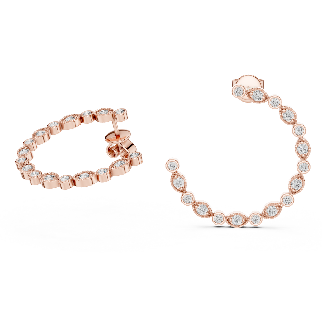 Rose gold hoop earrings with clear gemstones on a white background