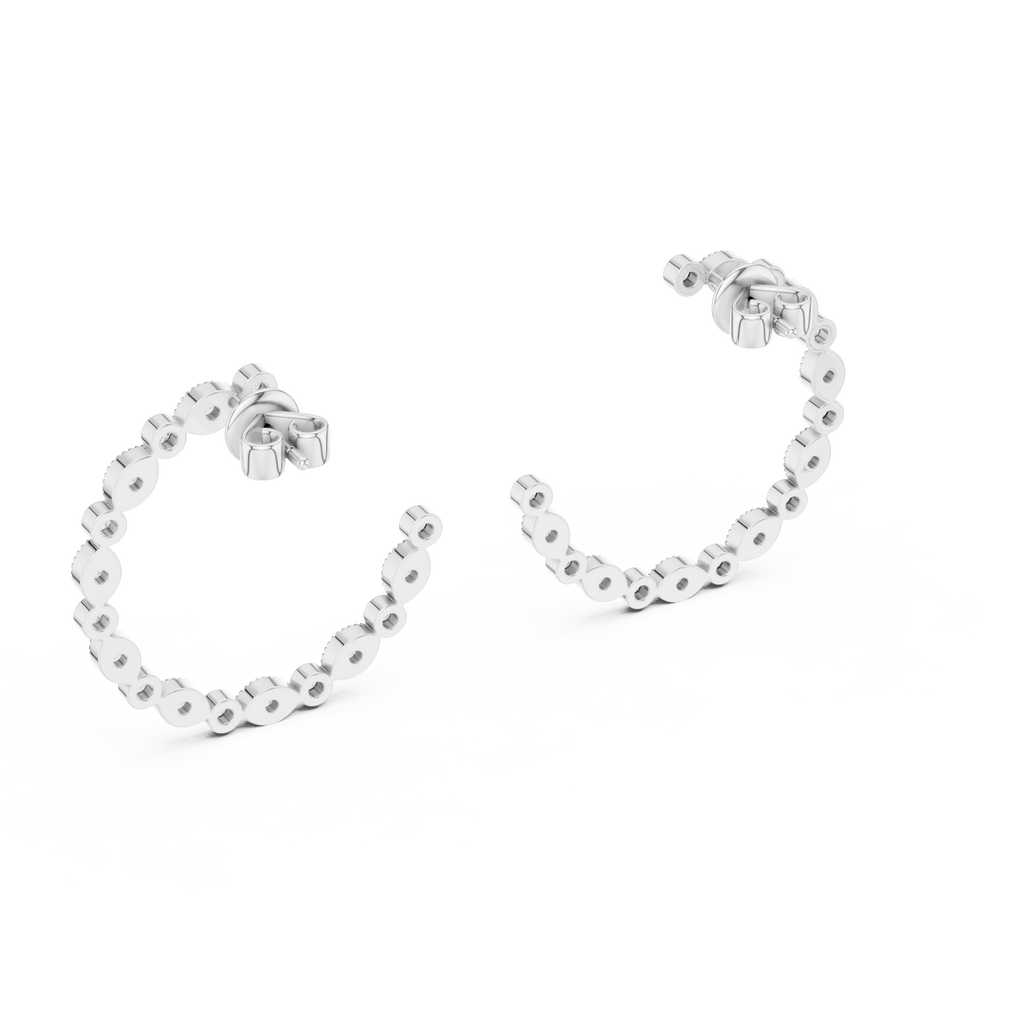 Silver hoop earrings with small round embellishments on a white background