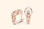 Rose gold lever back earrings with diamond accents on a white background