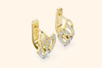 Golden diamond earrings with an interlocking loop design and shimmering round-cut stones.