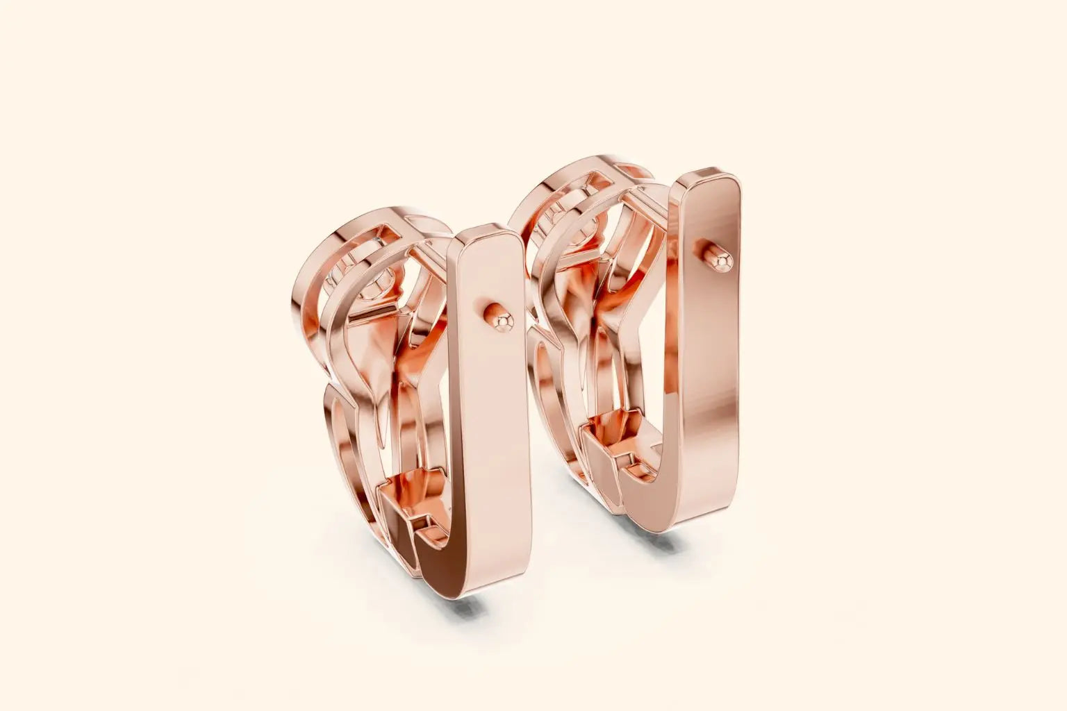 Rear view of rose gold lever-back earrings with an openwork design