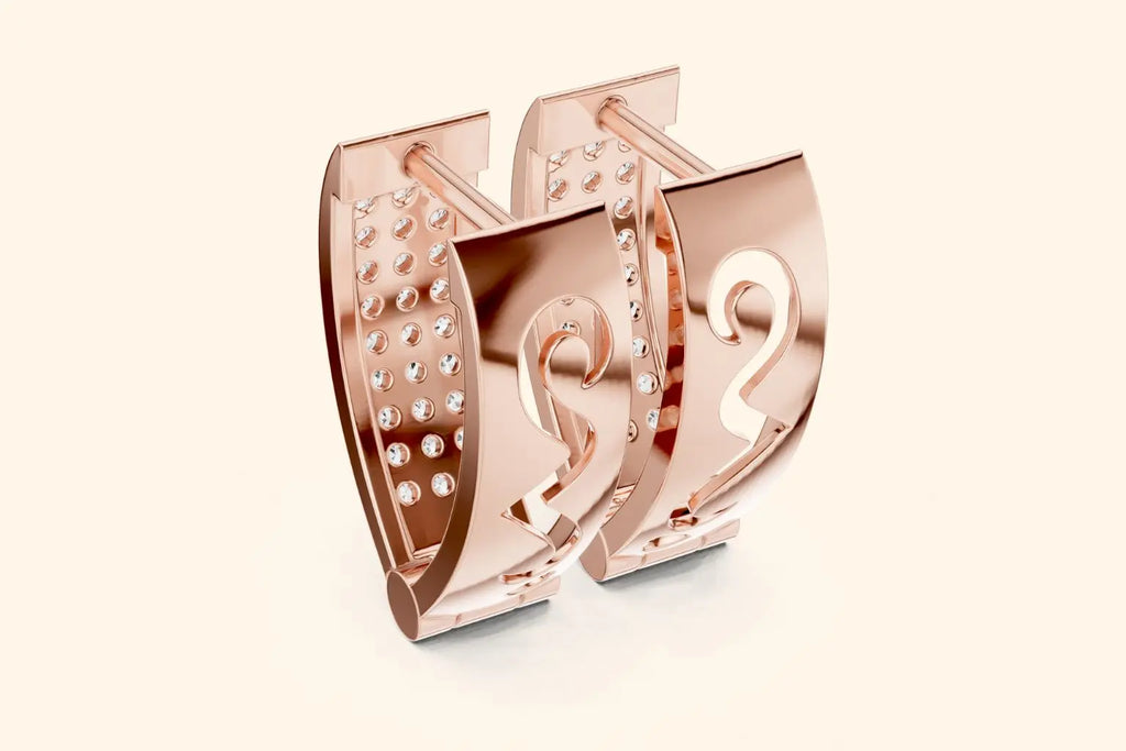 Rose gold lever-back earrings, one with diamonds and one with a cutout design.