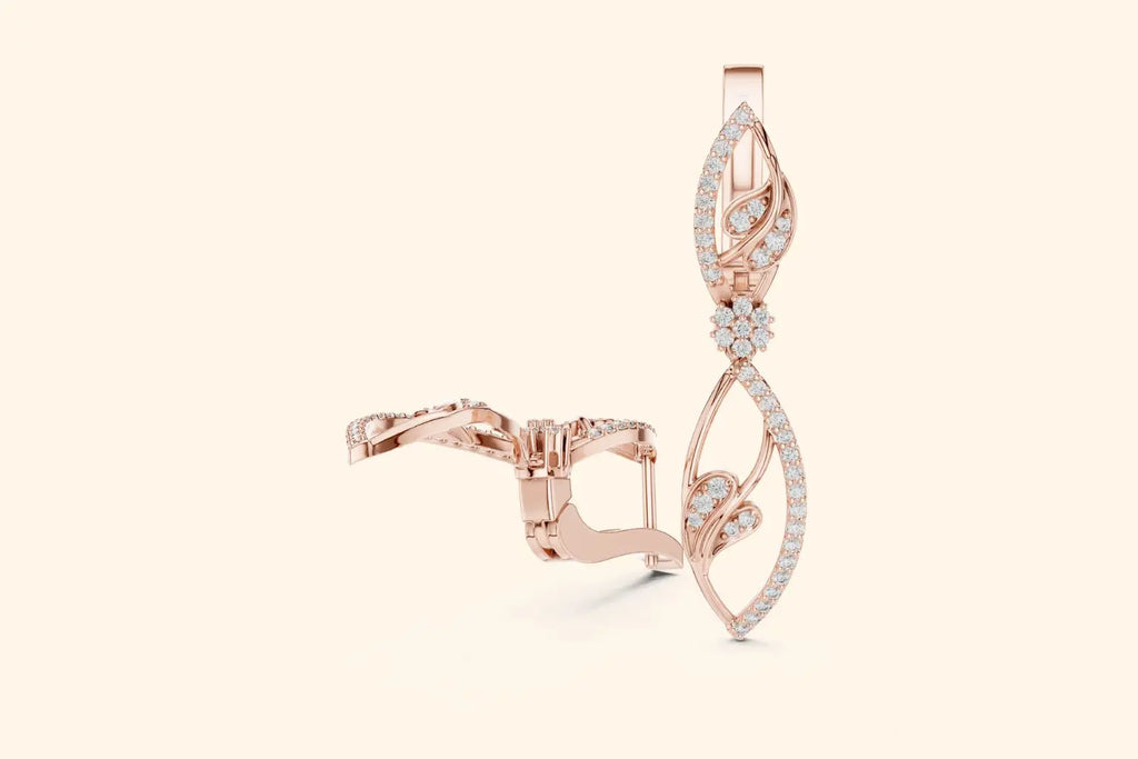 Rose gold earring with diamond accents on a light beige background