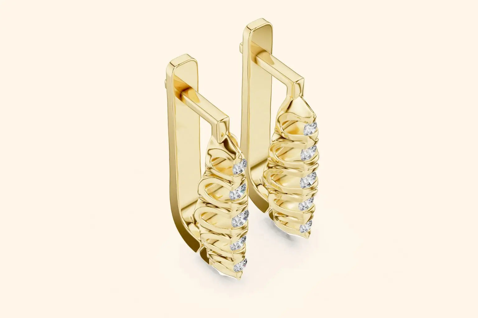 Gold earrings with intricate design on a beige background
