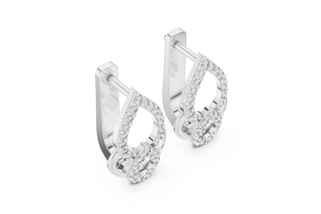 Pair of silver hoop earrings with clear gemstones on a white background
