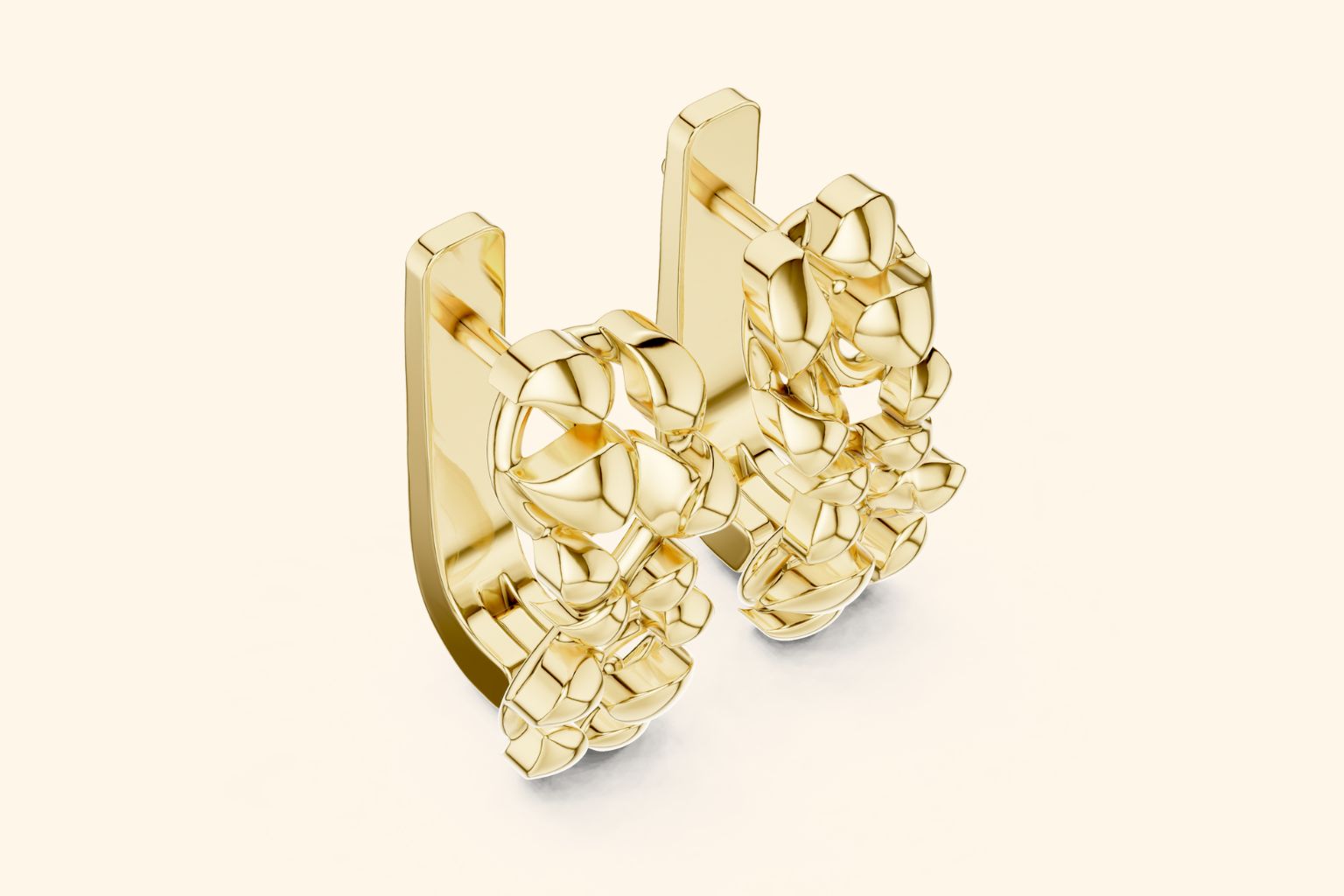 Gold earring on a light beige background