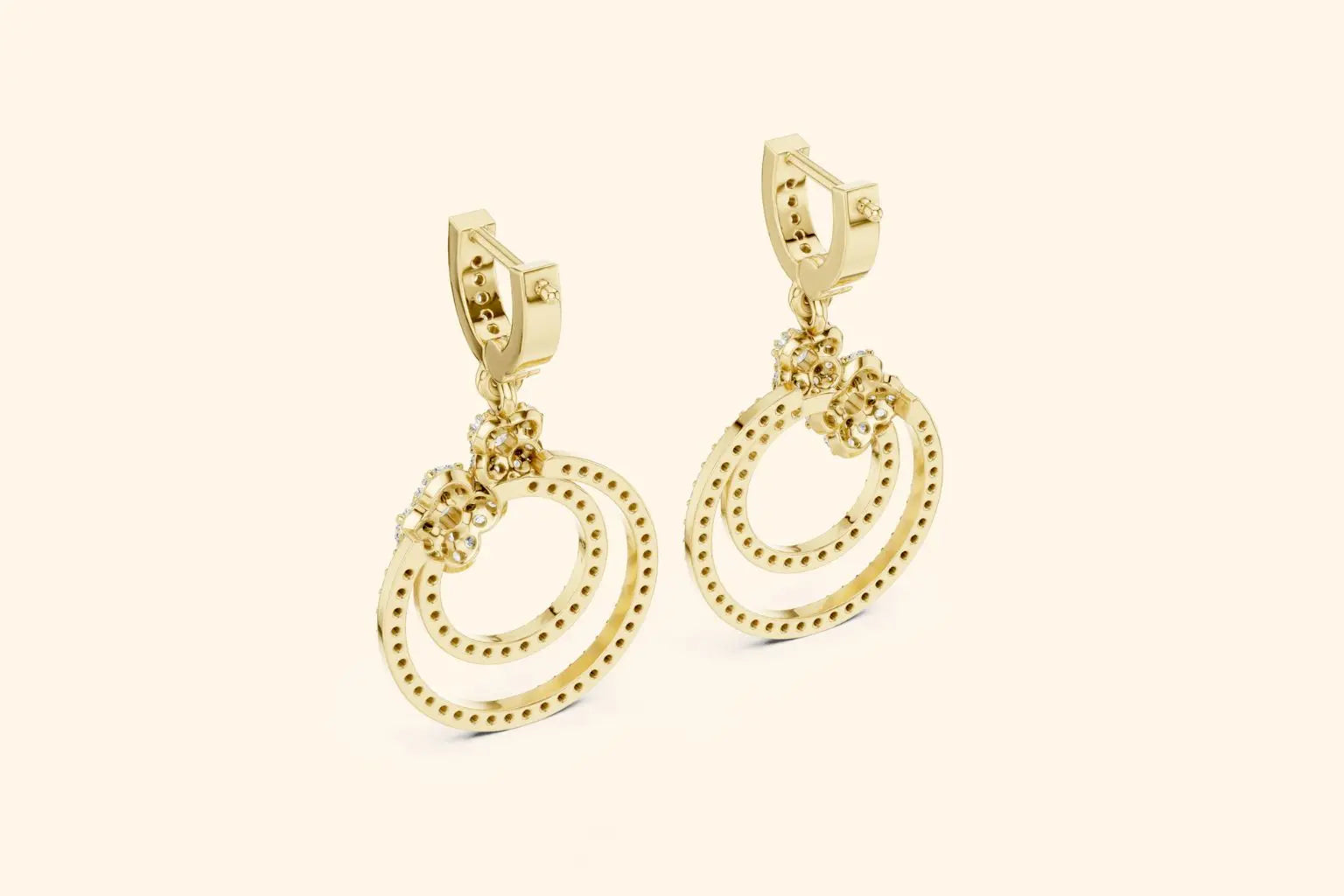 Gold hoop earrings on a beige background