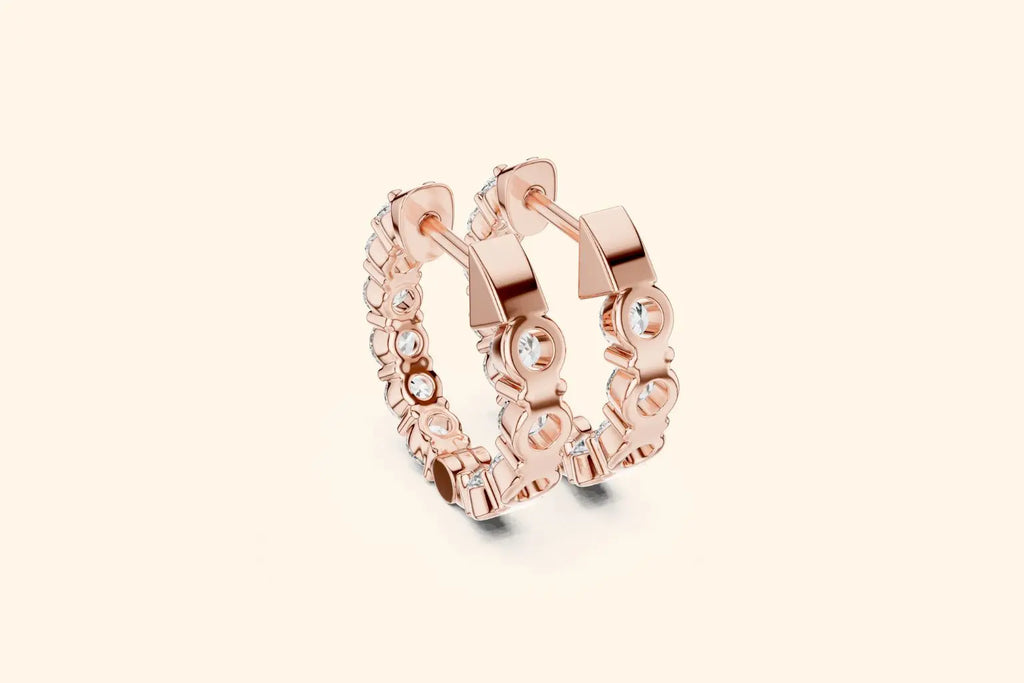 Pair of rose gold full eternity diamond hoop earrings with bezel setting showing the detailed side profile
