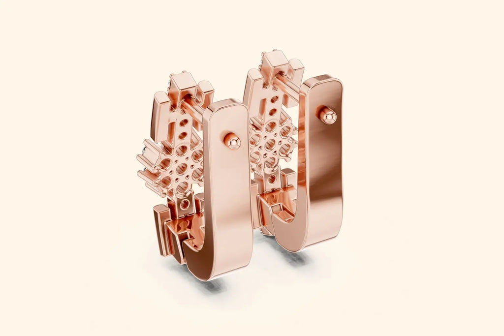 Rose gold hoop earrings on a light beige background