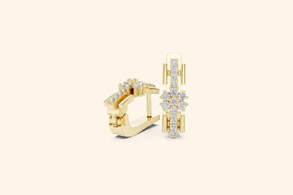 Gold hoop earrings with diamond accents on a light beige background