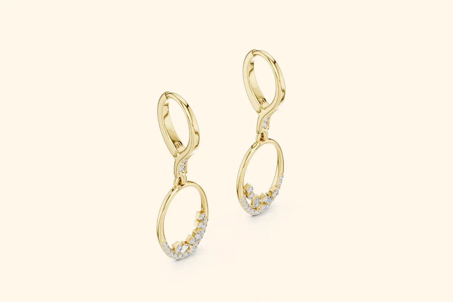 Gold earrings with circular design on a beige background
