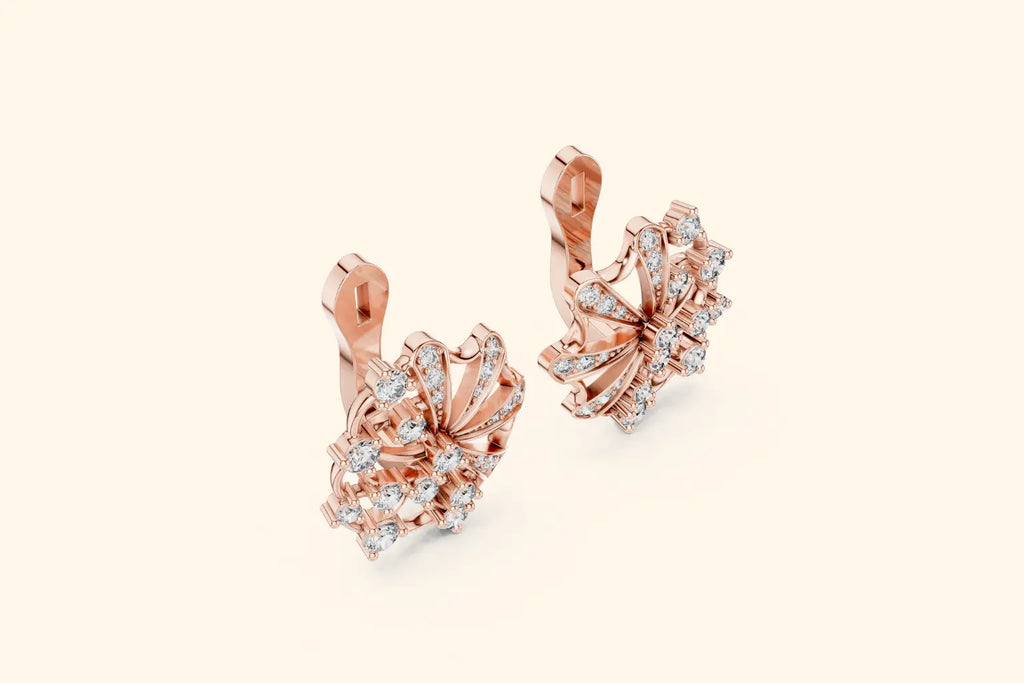 Rose gold earrings with diamond accents on a light beige background
