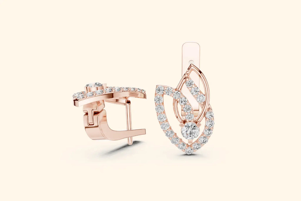 Rose gold earrings with heart design on a light beige background