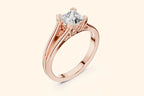 Front view of a rose gold solitaire engagement ring featuring a square brilliant-cut (Princess or Cushion) diamond set in a four-prong setting with decorative filigree details under the basket and a split-shank band.