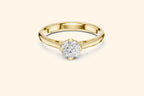 Front view of a yellow gold solitaire ring featuring an oval or marquise-cut diamond set horizontally in a four-prong basket on a smooth, wide, rounded band.