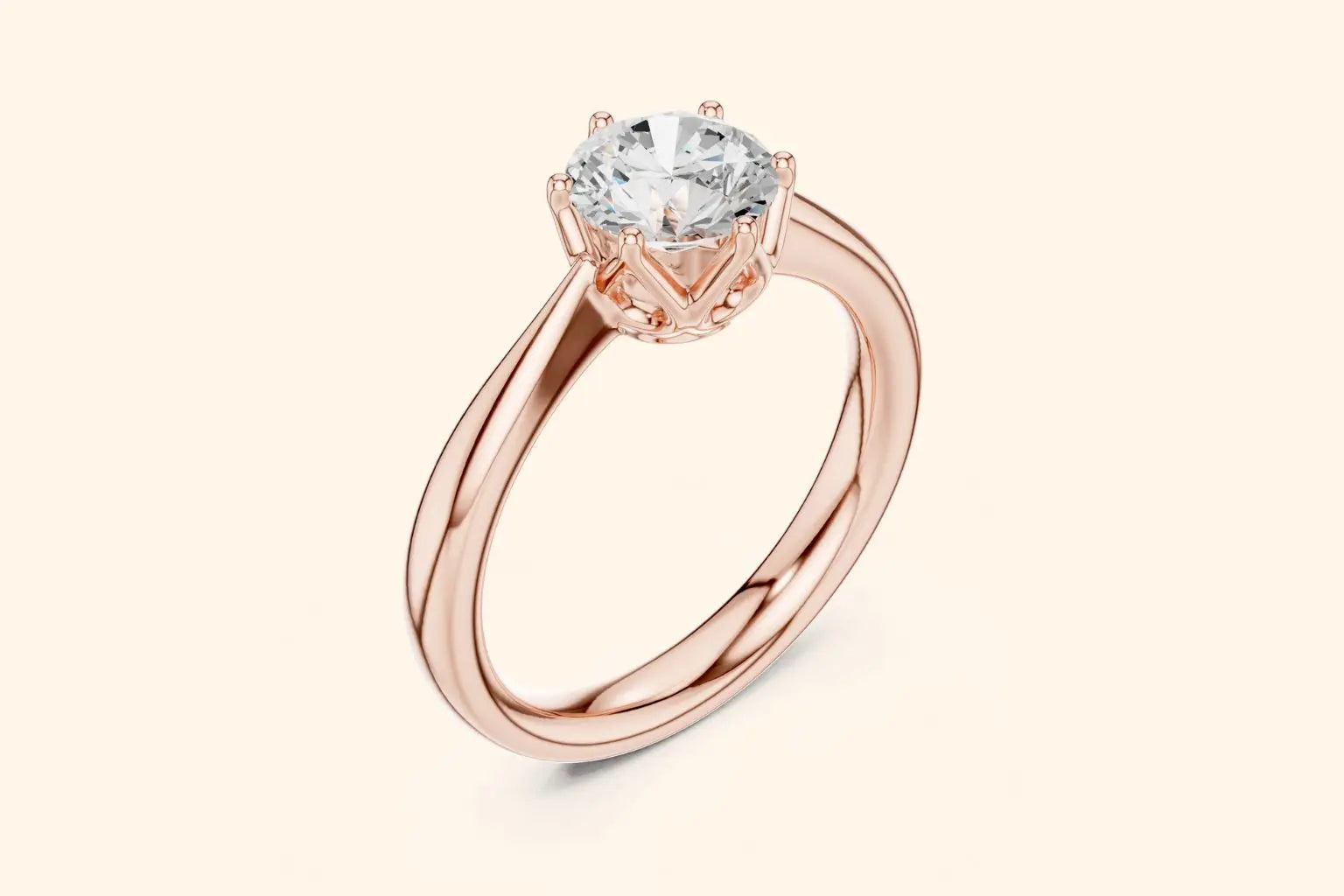 A three-quarter view of a delicate rose gold solitaire ring with a high-set brilliant diamond, emphasizing the thin, polished band and the intricate prong work.