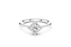 A modern solitaire engagement ring featuring a princess-cut diamond set diagonally in a four-prong setting on a polished white gold or platinum band.