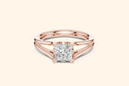 A modern solitaire ring featuring a rectangular diamond set on a wide, elegant split-shank band in polished rose gold.