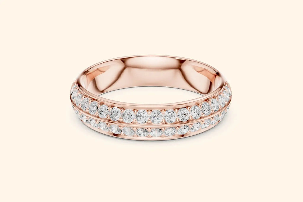 A thick, polished rose gold band ring featuring two continuous rows of pave-set round brilliant diamonds that cover the outer surface. The ring has a slightly domed profile, and the warm rose gold beautifully complements the sparkle of the diamonds.