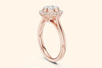A side-profile view of a slender rose gold ring. The centerpiece is a high-set diamond cluster arranged like a flower, surrounded by a diamond halo. The setting is elevated with a visible support structure beneath the halo.