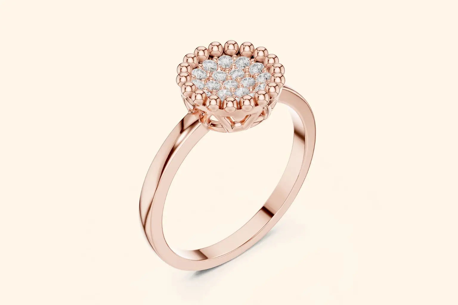 A three-quarter view of a delicate rose gold ring with a round, elevated setting. The head features a central cluster of pave diamonds surrounded by a distinctive beaded milgrain edge.