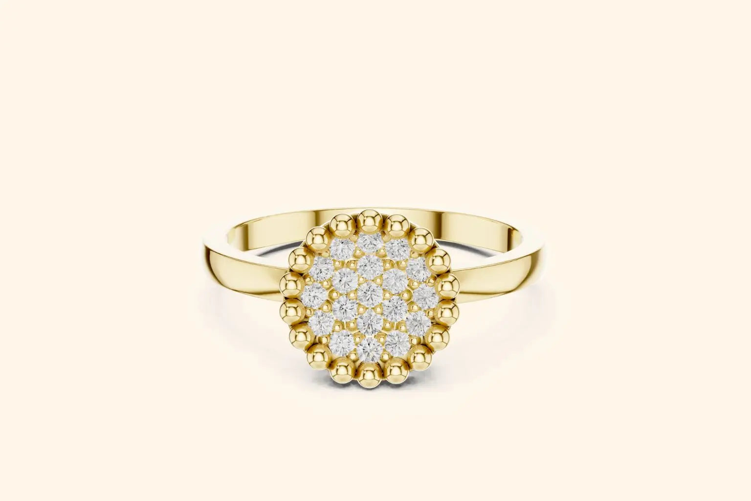 A front view of a stylish ring in bright gold or yellow gold. It showcases a round setting fully paved with diamonds, bordered by a pronounced beaded edge for texture and detail.