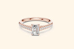 Elegant rose gold engagement ring with a brilliant radiant-cut diamond and micro-pavé shoulder diamonds.