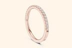 Rose gold ring with round-cut diamonds in a polished, elegant band design. 1
