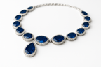 Blue sapphire necklace with white background