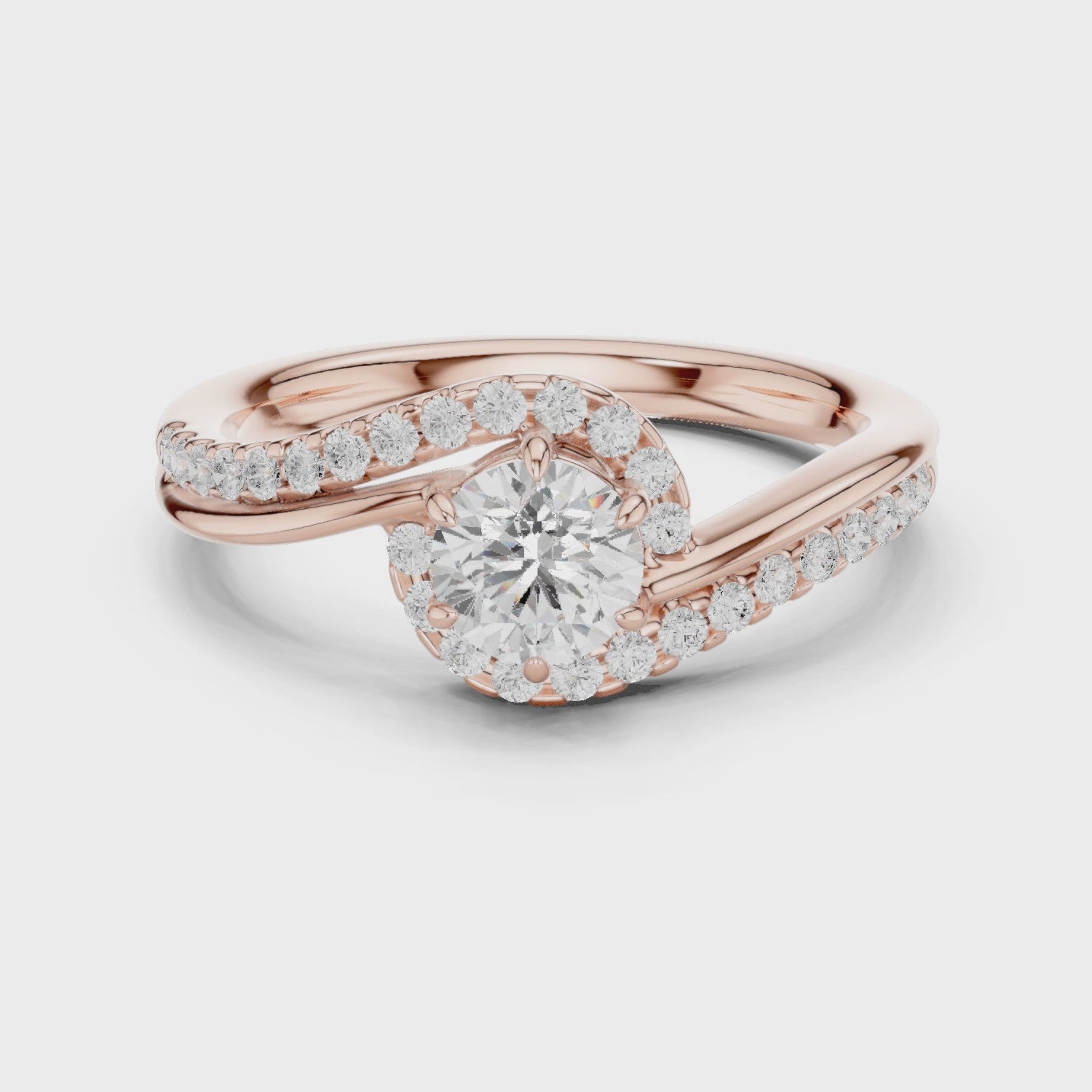 Elegant rose gold engagement ring with round diamond and ribbon-style setting