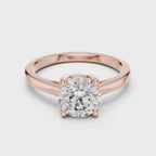Elegant rose gold engagement ring with round-cut diamond and pavé split shank for a timeless bridal look.