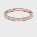 Rose gold ring with round-cut diamonds in a polished, elegant band design.