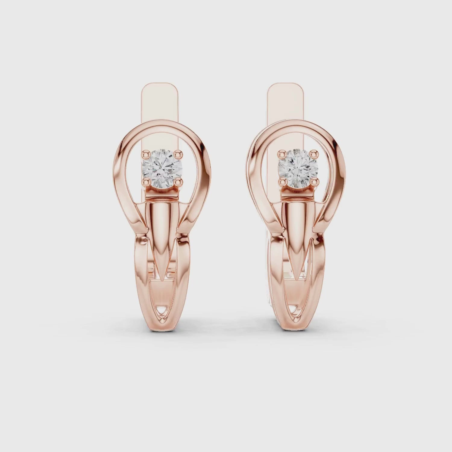 Rose gold lever back earrings with a diamond.