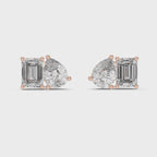Pair of rose gold mismatched diamond stud earrings featuring one emerald cut and one pear cut diamond on a white background